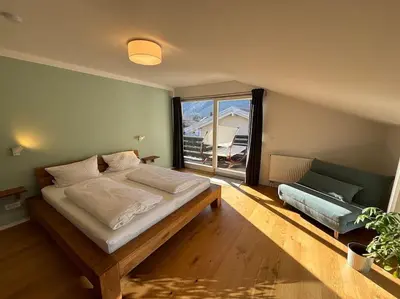 Ein Bett oder Betten in einem Zimmer der Unterkunft Fewo Bergblick Aschau im Chiemgau