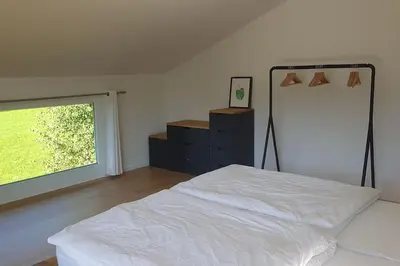 Ein Bett oder Betten in einem Zimmer der Unterkunft Fewo Bergblick Aschau im Chiemgau