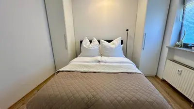 Ein Bett oder Betten in einem Zimmer der Unterkunft Lindenhof Apartment 13
