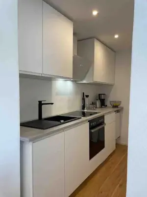 Küche/Küchenzeile in der Unterkunft Haus Hochland - Moderne Alpenwohnung Garten&Natur