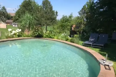 Der Swimmingpool an oder in der Nähe von Haus Hochland - Moderne Alpenwohnung Garten&Natur