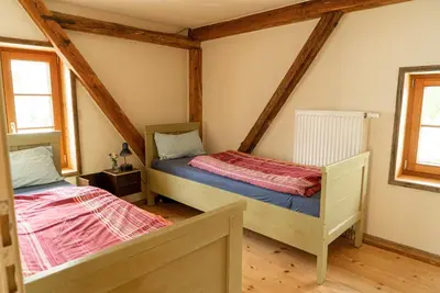 Ein Bett oder Betten in einem Zimmer der Unterkunft Ferienwohnung am Schmiedhof