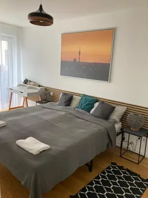 Ein Bett oder Betten in einem Zimmer der Unterkunft Casa Rumi Munich