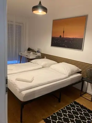 Ein Bett oder Betten in einem Zimmer der Unterkunft Casa Rumi Munich