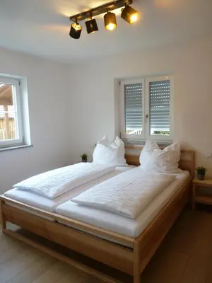 Ein Bett oder Betten in einem Zimmer der Unterkunft Ferienwohnungen Irmingard