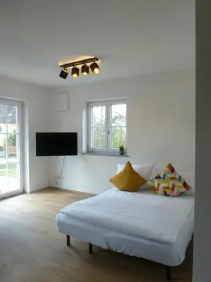 Ein Bett oder Betten in einem Zimmer der Unterkunft Ferienwohnungen Irmingard