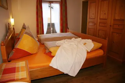 Ein Bett oder Betten in einem Zimmer der Unterkunft Haus Benedikt - Königscard-Gastgeber