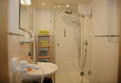 Ein Badezimmer in der Unterkunft Haus Benedikt - Königscard-Gastgeber