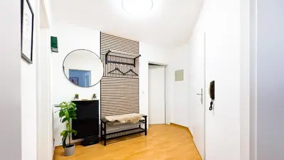 Ein Bett oder Betten in einem Zimmer der Unterkunft Moderne 3-Zimmer-Wohnung im Zentrum- Tiefgarage inklusive, Smart-TV, Shopping & Sightseeing ums Eck
