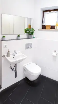 Ein Badezimmer in der Unterkunft Moderne 3-Zimmer-Wohnung im Zentrum- Tiefgarage inklusive, Smart-TV, Shopping & Sightseeing ums Eck