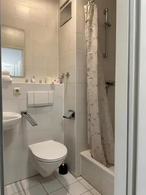 Ein Badezimmer in der Unterkunft Upper-House Goldener Hirsch