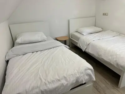 Ein Bett oder Betten in einem Zimmer der Unterkunft Upper-House Goldener Hirsch