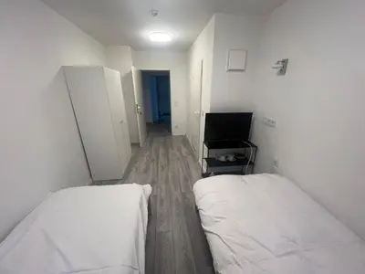 Ein Bett oder Betten in einem Zimmer der Unterkunft Upper-House Goldener Hirsch