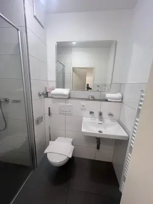 Ein Badezimmer in der Unterkunft Upper-House Goldener Hirsch