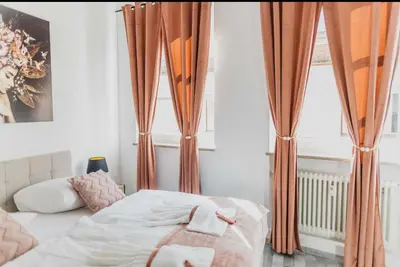 Ein Bett oder Betten in einem Zimmer der Unterkunft Ferienwohnung Zentrum Erding