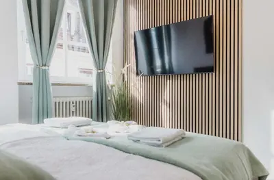 Ein Bett oder Betten in einem Zimmer der Unterkunft Ferienwohnung Zentrum Erding