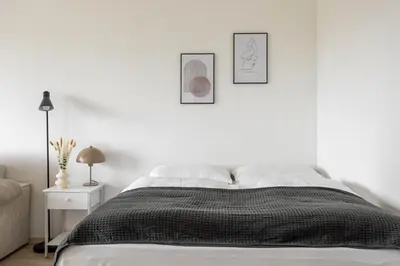 Ein Bett oder Betten in einem Zimmer der Unterkunft Global Living - Design Apartments I Terrace I Kitchen I Smart-TV I Parking space I München