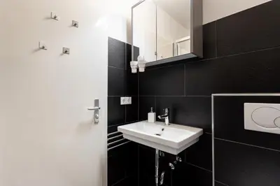 Ein Badezimmer in der Unterkunft Global Living - Design Apartments I Terrace I Kitchen I Smart-TV I Parking space I München