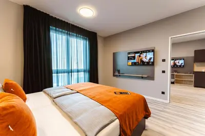 Ein Bett oder Betten in einem Zimmer der Unterkunft JustStay München Hotel & Apartments