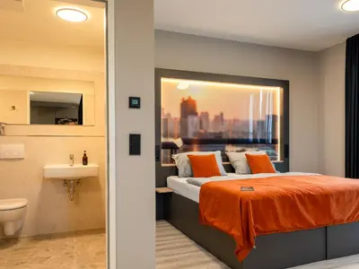 Ein Bett oder Betten in einem Zimmer der Unterkunft JustStay München Hotel & Apartments