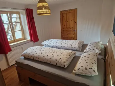 Ein Bett oder Betten in einem Zimmer der Unterkunft Sonnseitn FW