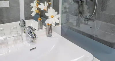 Ein Badezimmer in der Unterkunft PLAZA INN Dachau - München