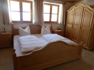 Ein Bett oder Betten in einem Zimmer der Unterkunft Gästehaus Becher, Kreuth-Point