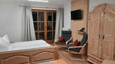 Ein Bett oder Betten in einem Zimmer der Unterkunft Ferienwohnung Uschi an der Rottachbrücke