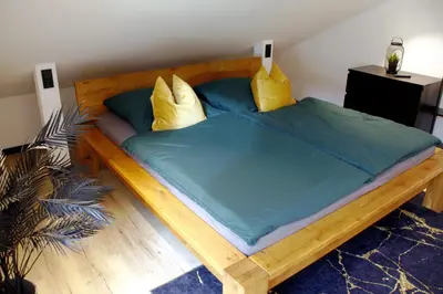 Ein Bett oder Betten in einem Zimmer der Unterkunft Ferienwohnung Haus Kampen