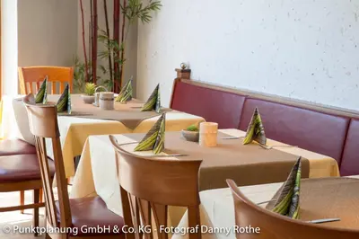 Ein Sitzbereich in der Unterkunft Hotel-Renner