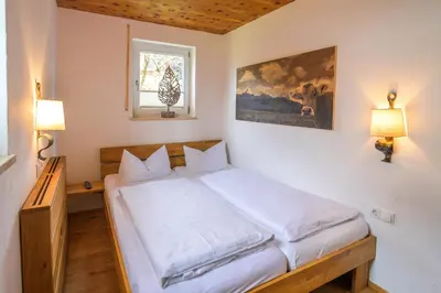 Ein Bett oder Betten in einem Zimmer der Unterkunft Alpencharme
