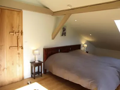 Ein Bett oder Betten in einem Zimmer der Unterkunft Ferienwohnung Villa sorglos Suite | Chiemgau Karte