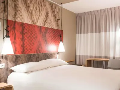 Ein Bett oder Betten in einem Zimmer der Unterkunft Ibis München City Arnulfpark