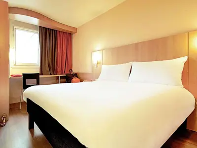 Ein Bett oder Betten in einem Zimmer der Unterkunft Ibis München City Arnulfpark