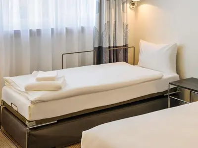 Ein Bett oder Betten in einem Zimmer der Unterkunft Novotel München City Arnulfpark