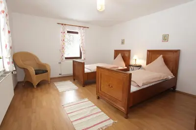 Ein Bett oder Betten in einem Zimmer der Unterkunft Ferienwohnungen am Märchenpark