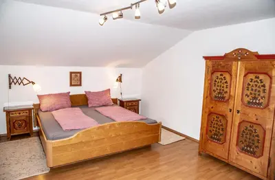 Ein Bett oder Betten in einem Zimmer der Unterkunft Ferienwohnungen am Märchenpark