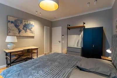 Ein Bett oder Betten in einem Zimmer der Unterkunft Wunderschönes Altbaujuwel in ruhiger Innenstadtlage