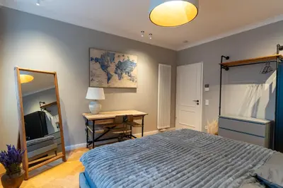 Ein Bett oder Betten in einem Zimmer der Unterkunft Wunderschönes Altbaujuwel in ruhiger Innenstadtlage