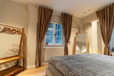 Ein Bett oder Betten in einem Zimmer der Unterkunft Traumhafte und hochwertige Stadtwohnung im Zentrum Augsburgs