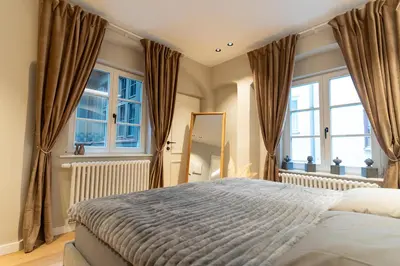 Ein Bett oder Betten in einem Zimmer der Unterkunft Traumhafte und hochwertige Stadtwohnung im Zentrum Augsburgs