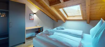 Ein Bett oder Betten in einem Zimmer der Unterkunft WeitsichtLodge