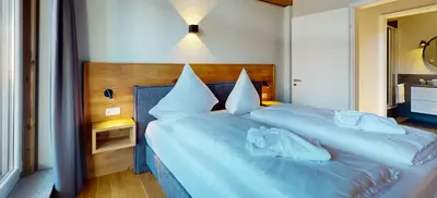 Ein Bett oder Betten in einem Zimmer der Unterkunft WeitsichtLodge