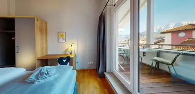 Ein Bett oder Betten in einem Zimmer der Unterkunft WeitsichtLodge
