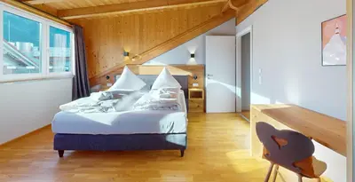 Ein Bett oder Betten in einem Zimmer der Unterkunft WeitsichtLodge