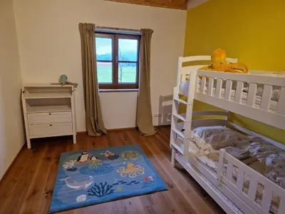 Ein Bett oder Betten in einem Zimmer der Unterkunft Bergeblick Bichl an der Ludlmühle