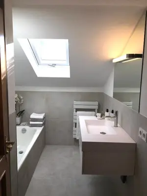 Ein Badezimmer in der Unterkunft Haus Hochland - Großzügige Alpenwohnung im Dachgeschoss