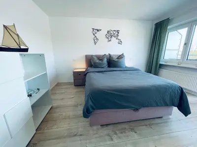 Ein Bett oder Betten in einem Zimmer der Unterkunft Das Bootshaus