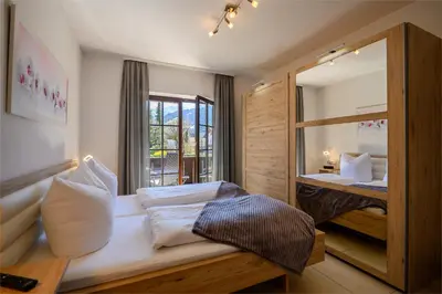Ein Bett oder Betten in einem Zimmer der Unterkunft Alpen-Residence