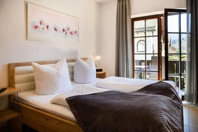 Ein Bett oder Betten in einem Zimmer der Unterkunft Alpen-Residence